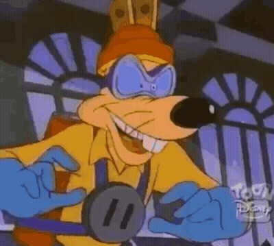 Cartoon Character In Yellow Shirt And Blue Gloves Smiling GIF