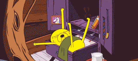 Cartoon Character Laying In Drawer With Unicorn Picture GIF