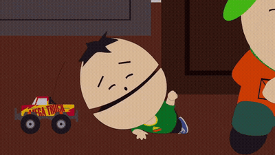 Cartoon Character Laying Next To Mega Truck GIF