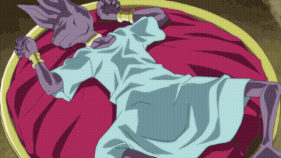 Cartoon Character Laying On Bed With Purple Blanket GIF