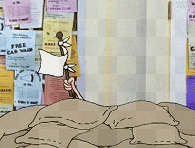 Cartoon Character Laying On Pile Of Pillows By Free Car Wash Ad GIF