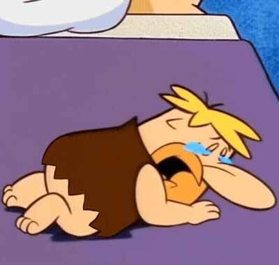 Cartoon Character Laying On Purple Surface Crying GIF