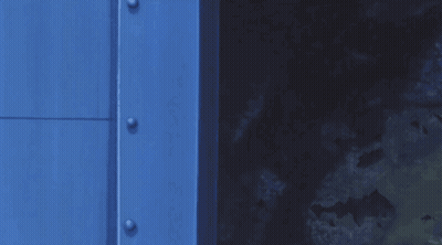 Cartoon Character Peeking Out Of Blue Door GIF