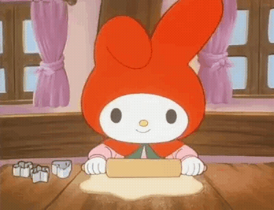 Cartoon Character Rolling Dough On Wooden Table GIF