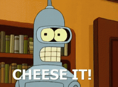 Cartoon Character Saying Cheese It In Front Of Bookshelf GIF