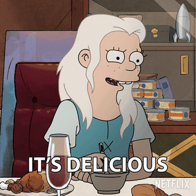 Cartoon Character Saying Its Delicious At Food Table GIF