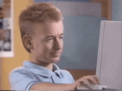 Cartoon Character Sitting At Computer GIF