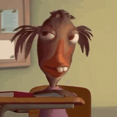 Cartoon Character Sitting At Desk With Book GIF