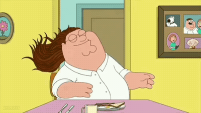 Cartoon Character Sitting At Table With Food GIF