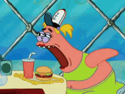 Cartoon Character Sitting At Table With Hamburger And Drink GIF