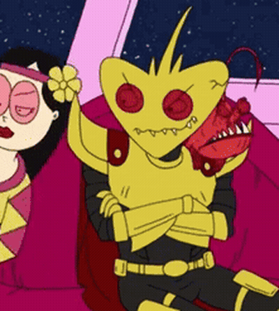 Cartoon Character Sitting Beside Woman With Flower In Hair GIF
