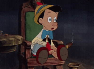 Cartoon Character Sitting In Chair Holding Mug GIF