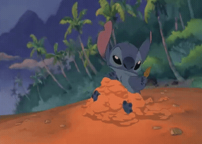 Cartoon Character Sitting In Pile Of Sand GIF