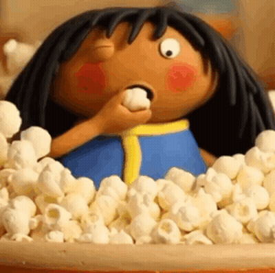 Cartoon Character Sitting In Popcorn Bowl Eating Marshmallow GIF