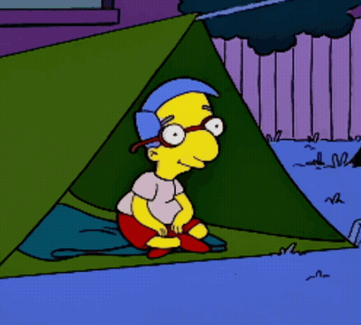 Cartoon Character Sitting In Tent With Glasses GIF