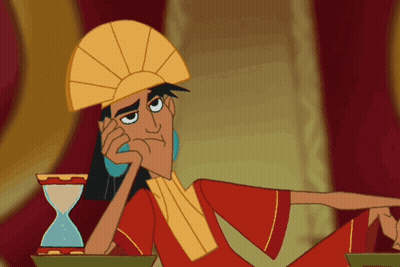 Cartoon Character Sitting Next To Hourglass GIF