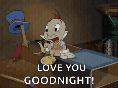Cartoon Character Sitting On Bed Saying Love You Goodnight GIF