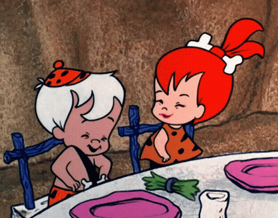 Cartoon Character Sitting On Bed With Lamp GIF