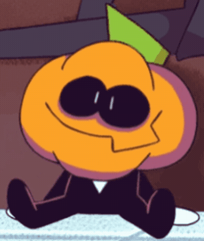 Cartoon Character Sitting on Table With Green Hat