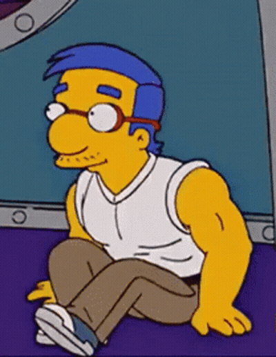Cartoon Character Sitting With Glasses GIF