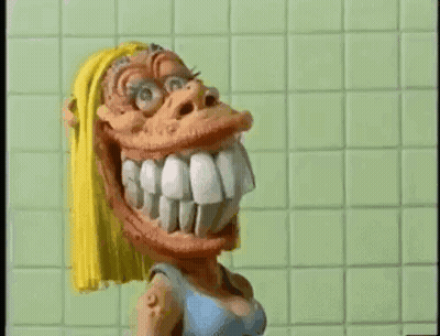 Cartoon Character Smiling in Front of Green Tiled Wall