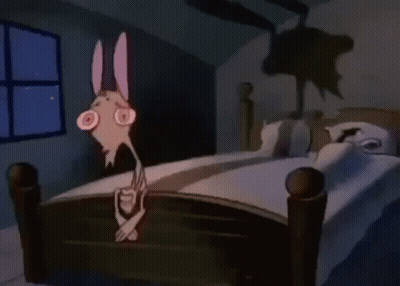 Cartoon Character Standing By Bed With Shadow GIF