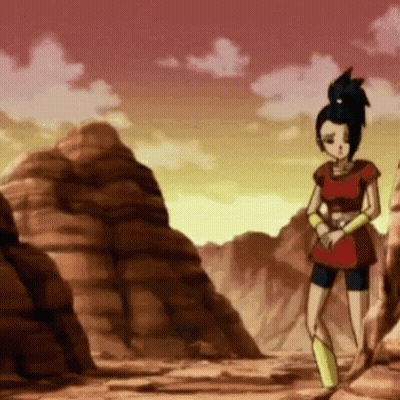 Cartoon Character Standing In Desert Surrounded By Rocks And Mountains GIF