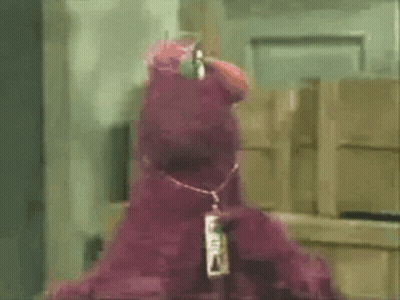 Cartoon Character Standing In Field With Arms Up GIF