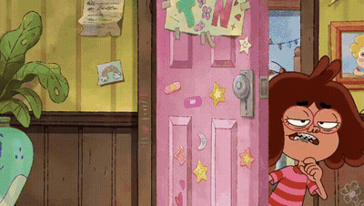 Cartoon Character Standing in Front of Pink Door With TNW Stickers