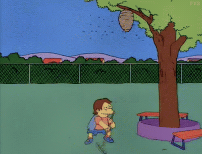 Cartoon Character Standing In Front Of Tree With Beehive GIF