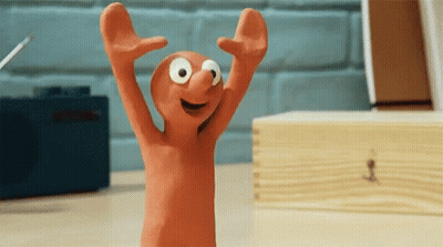 Cartoon Character Standing On Desk Arms Up GIF
