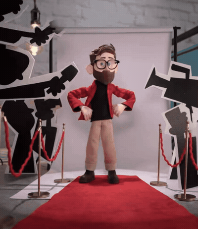 Cartoon Character Standing On Red Carpet In Front Of Cameras GIF