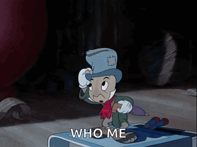 Cartoon Character Standing On Table Saying Who Me GIF