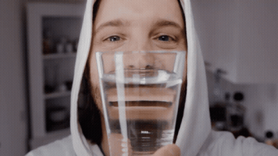 Cartoon Character With Arm Cast Surrounded By Disney Characters GIF