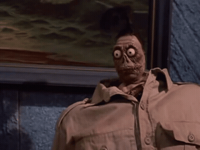 Cartoon Character With Big Eyes And Tan Jacket GIF
