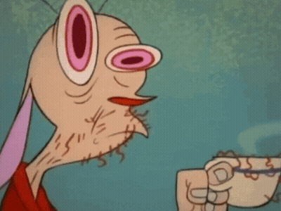 Cartoon Character With Big Pink Eyes Smiling And Pointing GIF