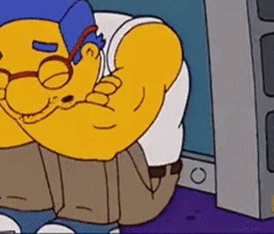 Cartoon Character With Blue Hat And Glasses Flexing GIF