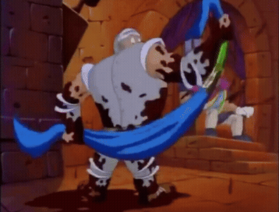 Cartoon Character With Blue Scarf Standing Next To Brick Wall GIF
