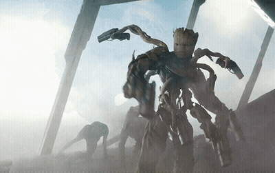 Cartoon Character With Crown Holding Guns GIF