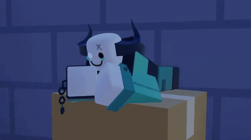 Cartoon Character With Horns And X On Head Laying On Box GIF