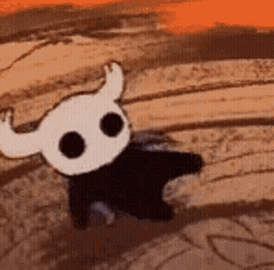 Cartoon Character With Horns Walking Across Dirt Field GIF