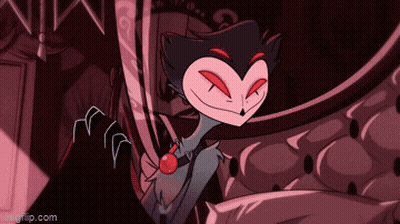 Cartoon Character With Red Eyes And Bow Tie Sitting On Couch GIF