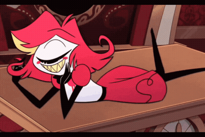 Cartoon Character With Red Hair And Big Teeth Laying On Table GIF