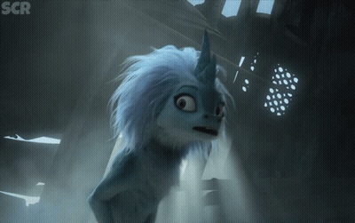 Cartoon Character With Unicorn Horn In Dark Room GIF