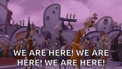Cartoon Characters Dancing In Front Of Building Saying We Are Here GIF