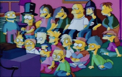 Personajes de caricatura sentados frente al televisor con Snu GIF