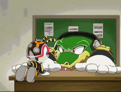 Cartoon Characters Sitting On A Desk GIF