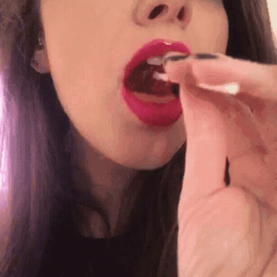 Cartoon Child Holding Pink And Purple Lollipop GIF