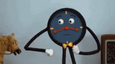 Cartoon Clock Standing Next To Stuffed Animal GIF