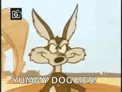Cartoon Coyote Standing In Desert Saying Yummy Doggies GIF